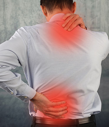 Man suffering from auto accident injuries in need of a Roseville Chiropractor at Well Being Chiropractic
